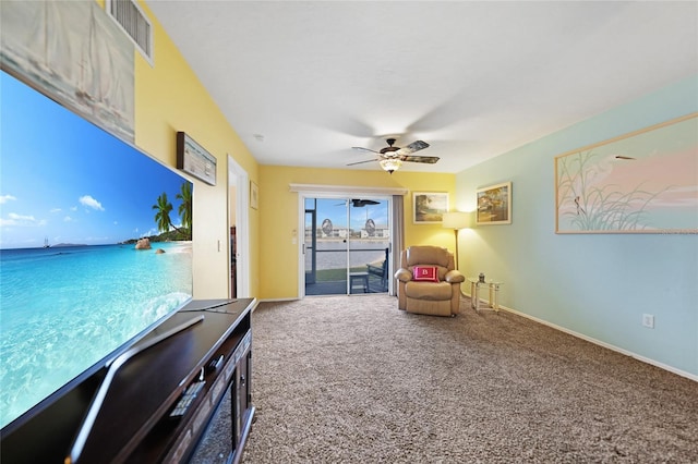 unfurnished room featuring baseboards, carpet, visible vents, and a ceiling fan