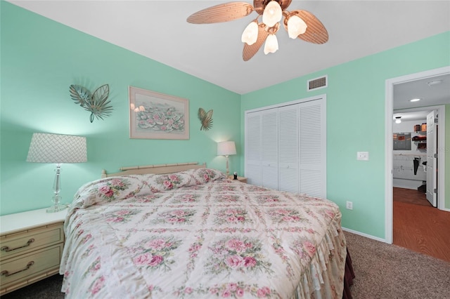 bedroom with ceiling fan, visible vents, baseboards, a closet, and dark colored carpet