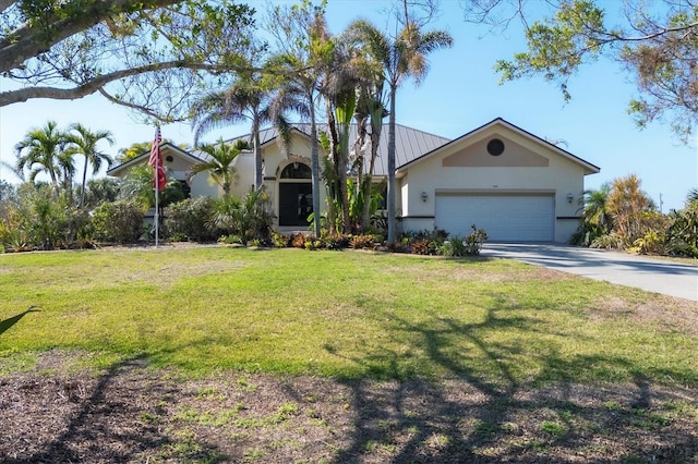 ranch-style house featuring a garage and a front lawn