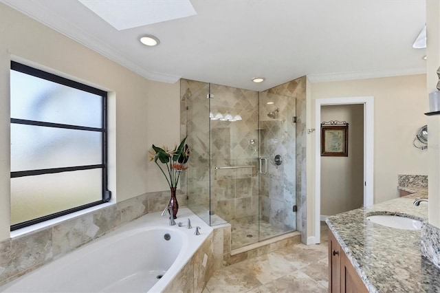 bathroom with vanity, shower with separate bathtub, crown molding, and a skylight