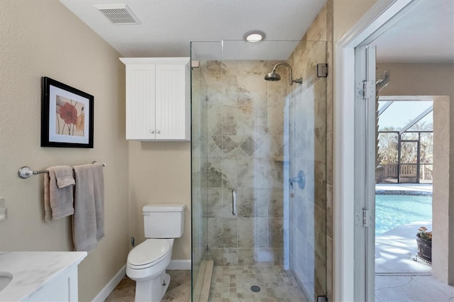 bathroom featuring walk in shower, vanity, and toilet