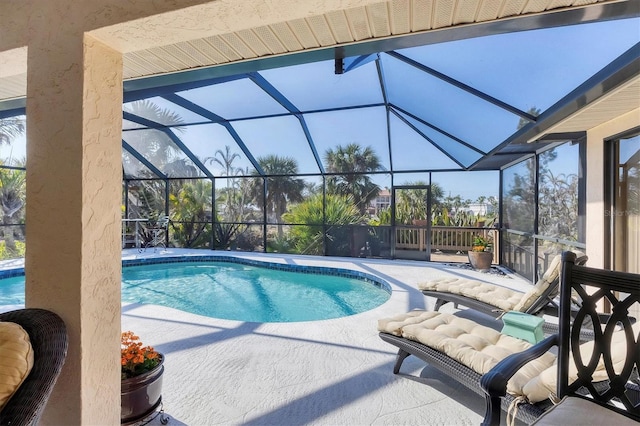 view of pool featuring a lanai and a patio area