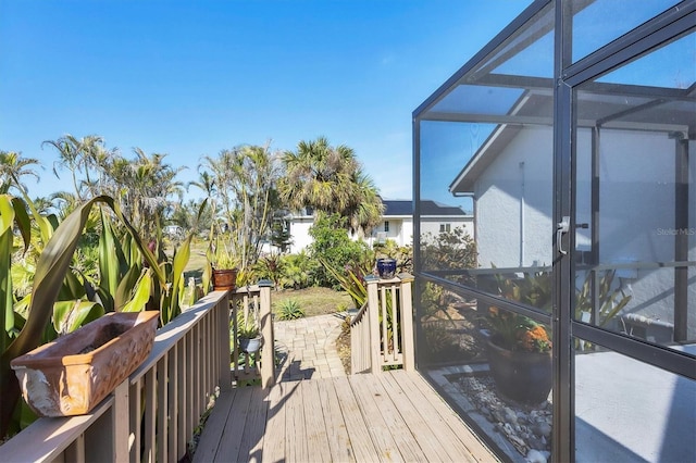 wooden deck featuring a lanai