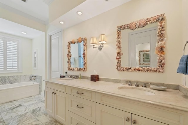 bathroom featuring vanity and a bath