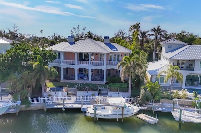 back of property with a water view