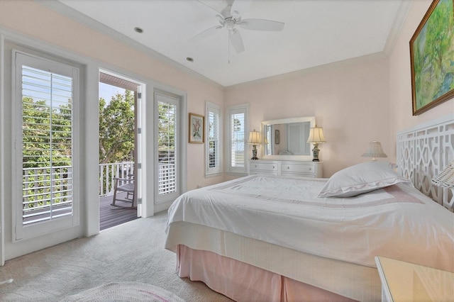 bedroom featuring multiple windows, ornamental molding, light colored carpet, and access to exterior