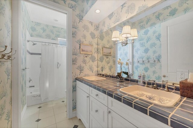 bathroom featuring tile patterned flooring, vanity, and shower / bathtub combination with curtain