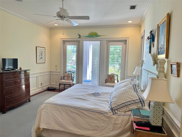 bedroom featuring crown molding, ceiling fan, and carpet