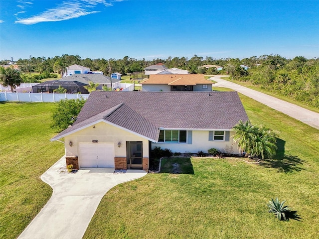 view of front of home featuring a garage and a front yard