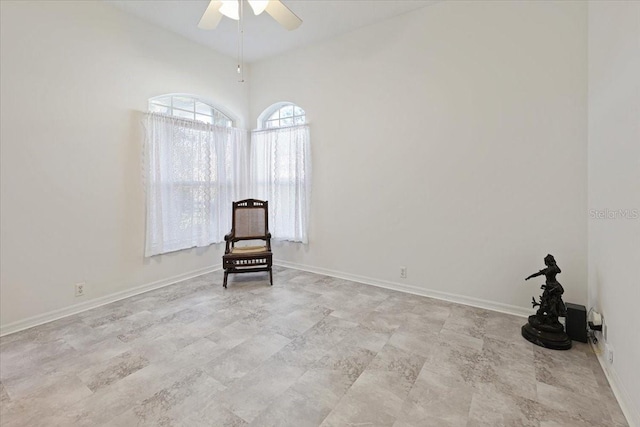 unfurnished room featuring lofted ceiling and ceiling fan