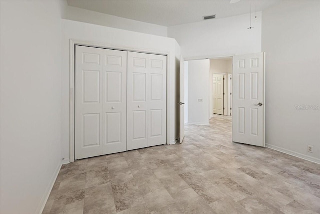 unfurnished bedroom with a closet