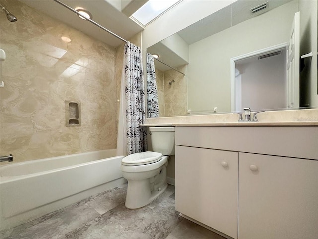 full bathroom featuring vanity, shower / bath combination with curtain, and toilet