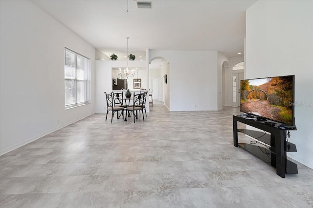 dining space featuring a notable chandelier