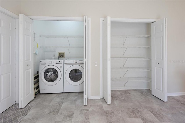 laundry area with independent washer and dryer