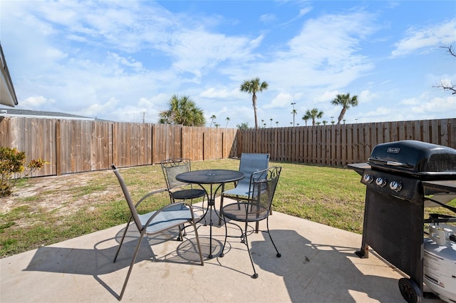 view of patio featuring a grill