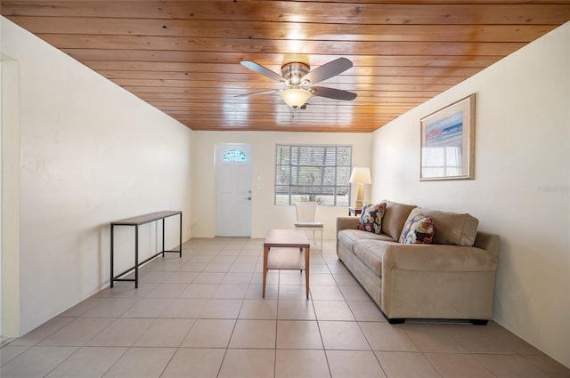 living room with light tile patterned floors, wood ceiling, and ceiling fan