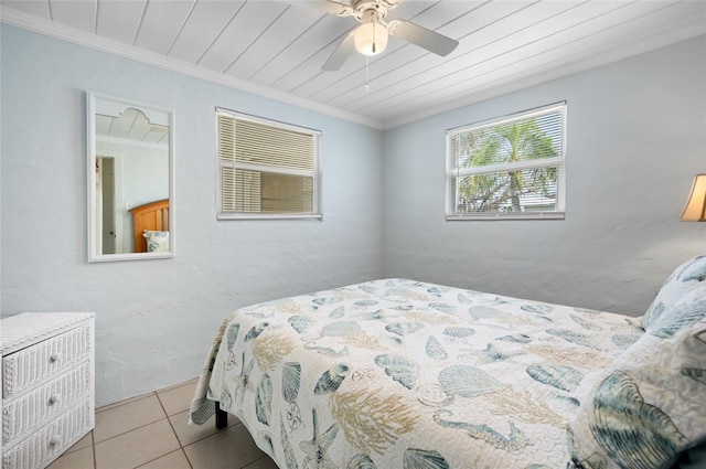 bedroom featuring ornamental molding, light tile patterned floors, ceiling fan, and wood ceiling