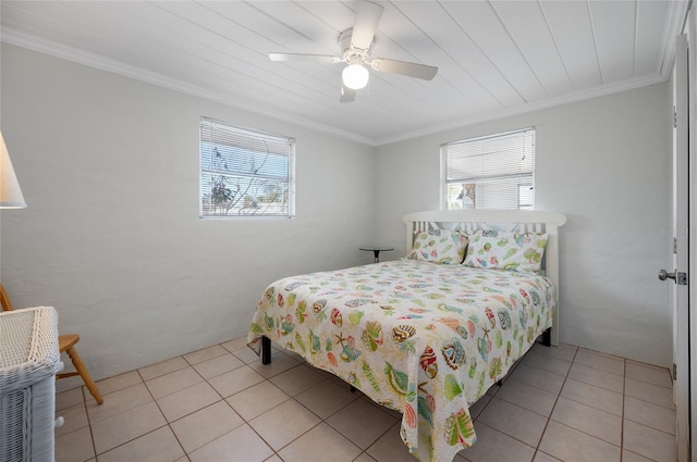 bedroom featuring light tile patterned floors, ornamental molding, and ceiling fan