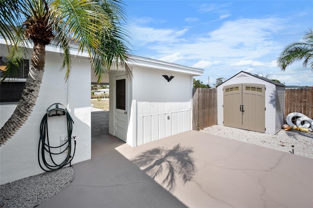 view of patio / terrace with a shed