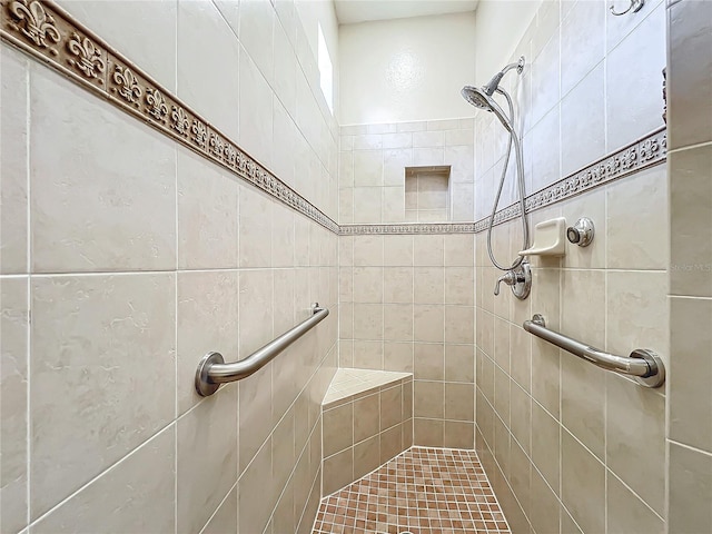 bathroom with tiled shower