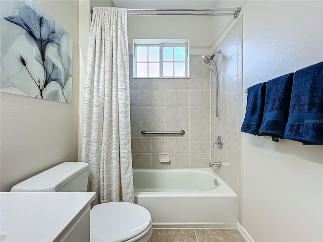 full bathroom featuring shower / tub combo with curtain, vanity, tile patterned flooring, and toilet