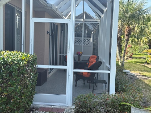 view of patio with a sunroom