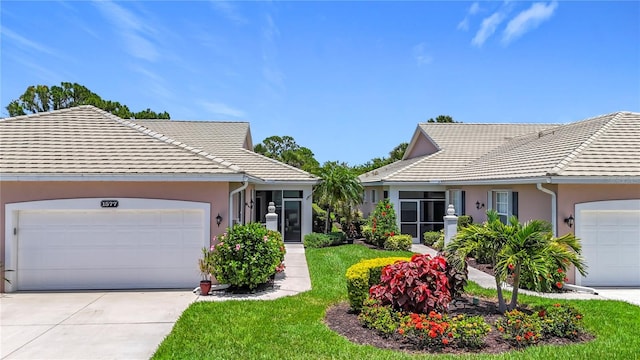 1577 Monarch Dr Unit 1577, Venice, FL 34293 - single story home featuring a tiled roof, stucco siding, a garage, and concrete driveway