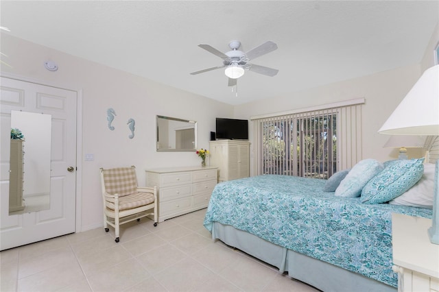 tiled bedroom with ceiling fan