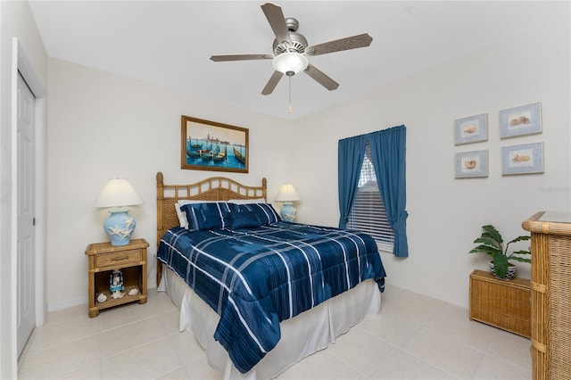 tiled bedroom with a closet and ceiling fan