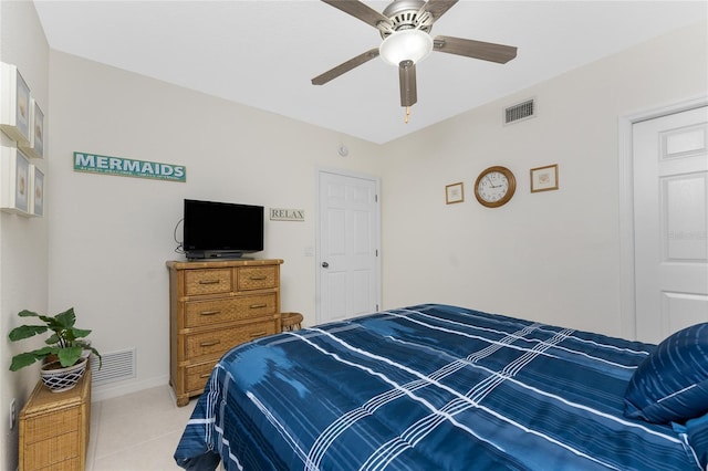 tiled bedroom with ceiling fan