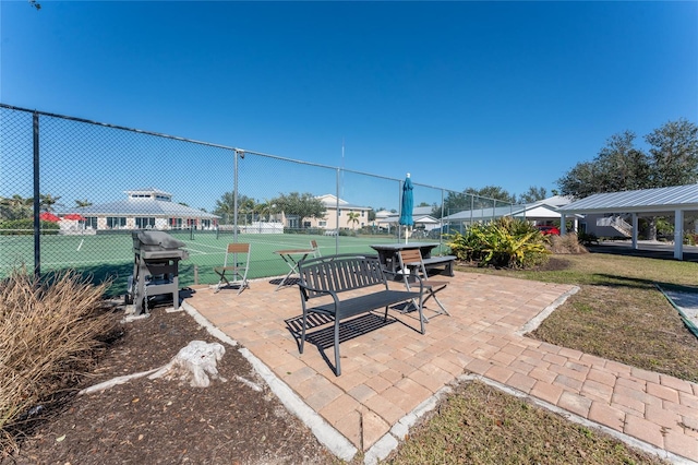 view of patio featuring a grill and tennis court