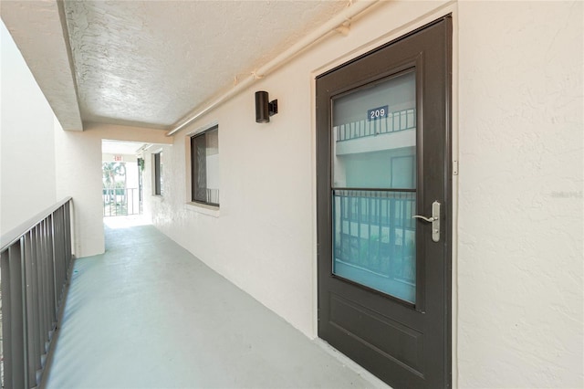 entrance to property with a balcony