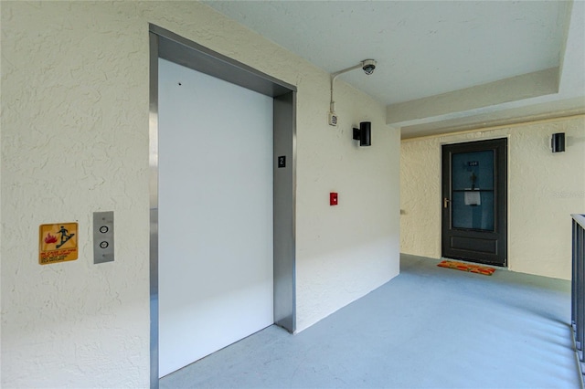 entrance to property featuring elevator