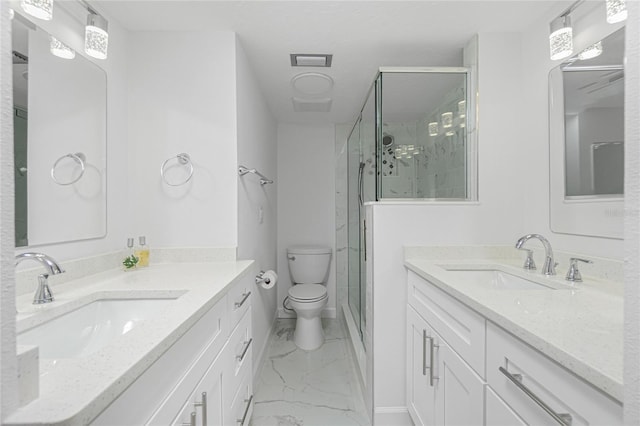 bathroom with vanity, an enclosed shower, and toilet