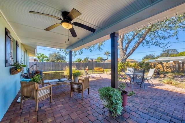 view of patio with ceiling fan and an outdoor living space