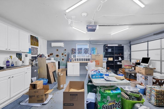 garage featuring sink, a garage door opener, and a wall mounted AC