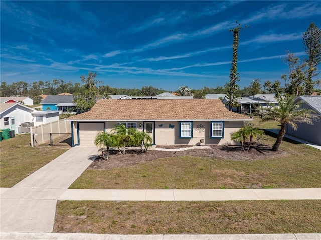 ranch-style home with stucco siding, concrete driveway, an attached garage, fence, and a front lawn