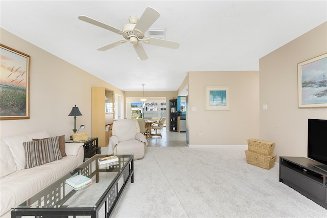 living area featuring ceiling fan and light colored carpet