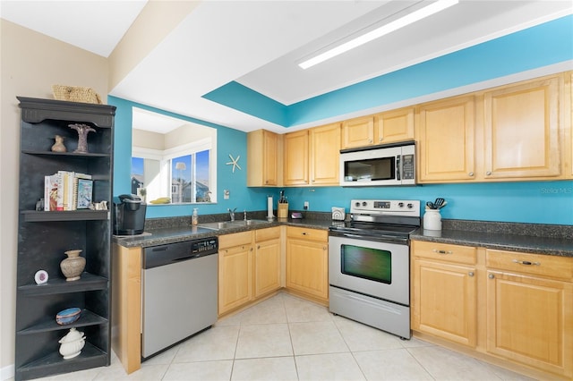 kitchen with light tile patterned floors, stainless steel appliances, a sink, open shelves, and dark countertops