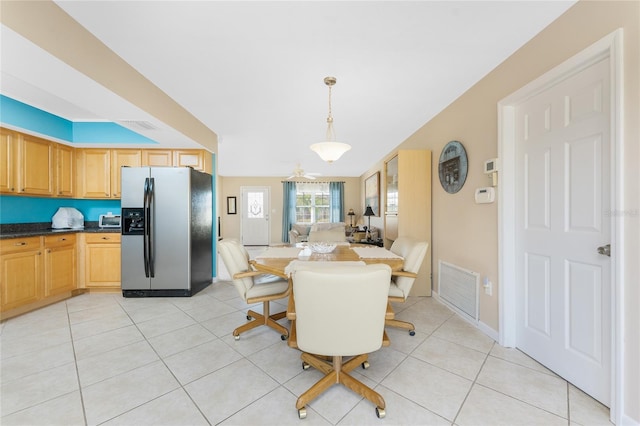 dining room with visible vents and light tile patterned flooring