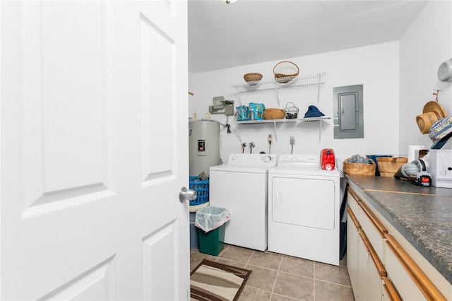 washroom featuring electric panel, electric water heater, independent washer and dryer, and light tile patterned floors