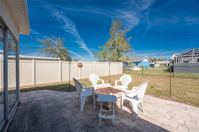 view of patio with a fire pit and a fenced backyard