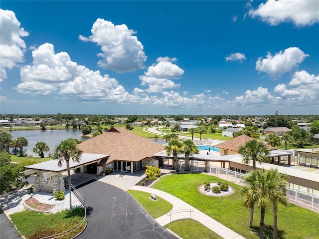 birds eye view of property featuring a water view and a residential view