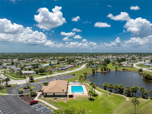 drone / aerial view featuring a water view and a residential view