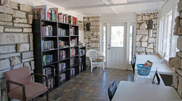 sitting room with dark tile patterned flooring