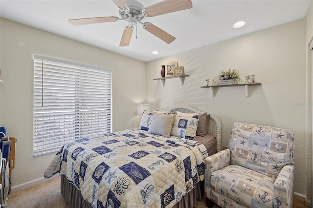 carpeted bedroom featuring ceiling fan