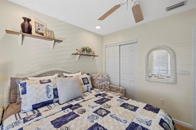 bedroom featuring ceiling fan and a closet