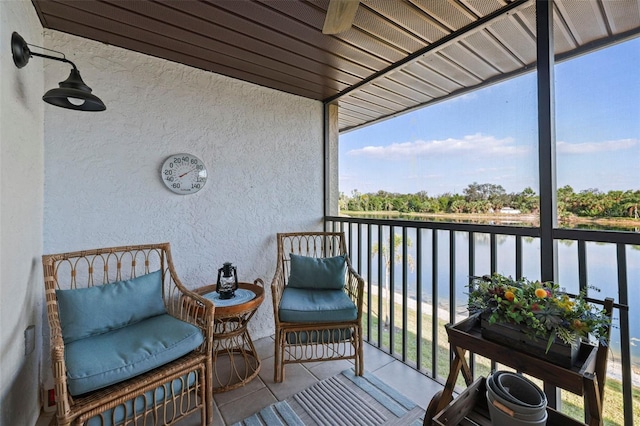 balcony featuring a water view