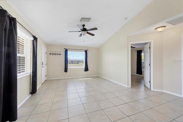 unfurnished room featuring lofted ceiling, light tile patterned floors, and ceiling fan