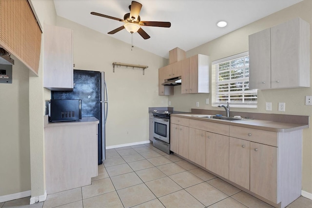 kitchen with lofted ceiling, sink, light tile patterned floors, electric range, and ceiling fan